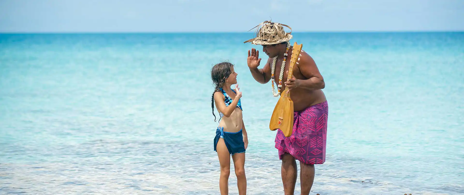 Child with Polynesian musician
